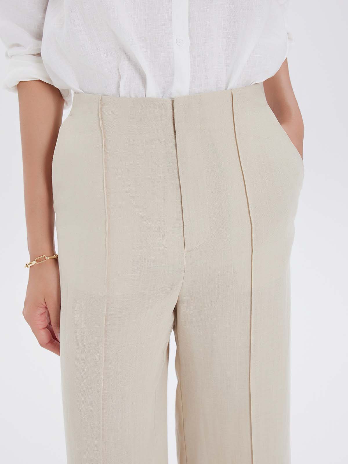 Beige pants worn with a white shirt 