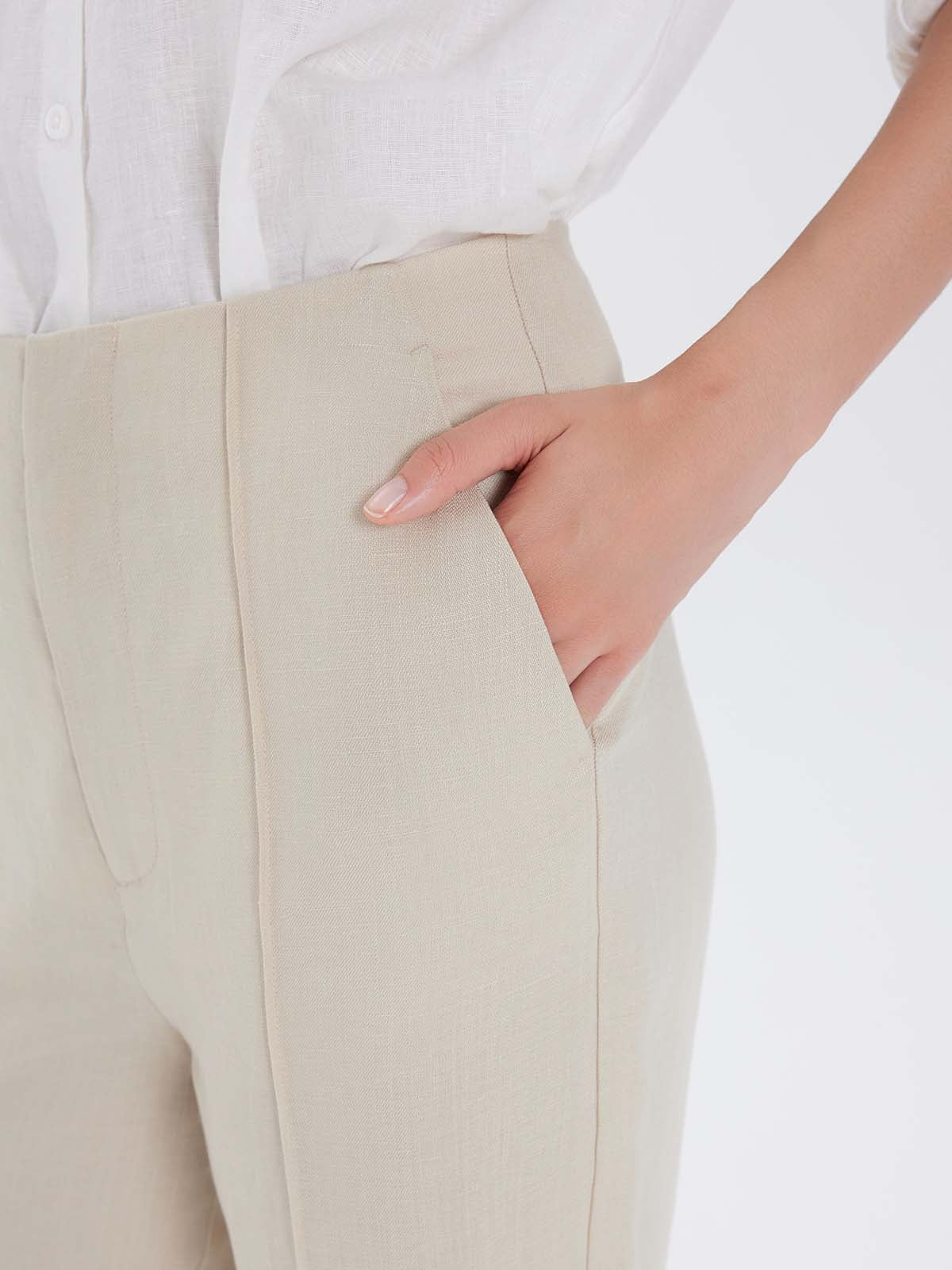 Beige pants with a white shirt